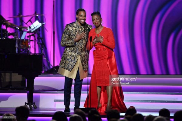 LAS VEGAS, NEVADA - APRIL 03: Pierce Freelon and Nnenna Freelon speak onstage during the 64th Annual GRAMMY Awards Premiere Ceremony at MGM Grand Marquee Ballroom on April 03, 2022 in Las Vegas, Nevada. (Photo by Denise Truscello/Getty Images for The Recording Academy)